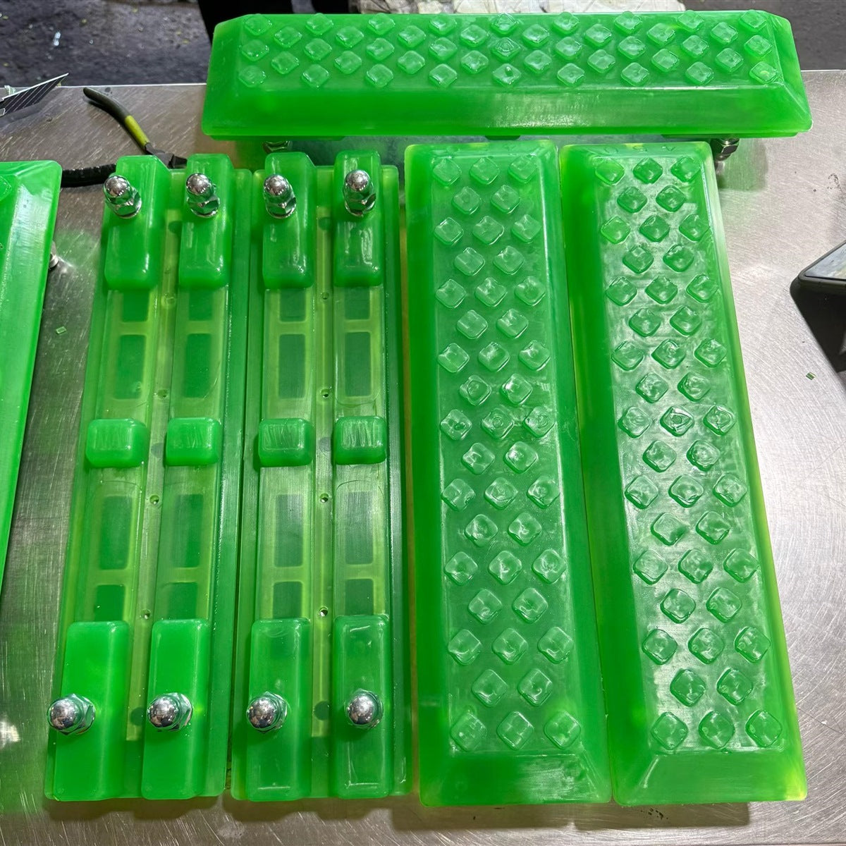 450mm VectorMax bolt-on polyurethane excavator track pad used in a track pad measuring guide